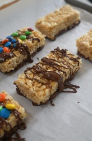 drizzle your copycat kudos bars with chocolate