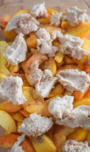 Add spoonfuls of the mixture on top of the peach mixture