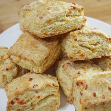 Final baked cheddar biscuits on a plate